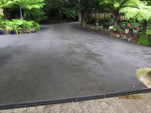 Looking across the newly asphalted driveway