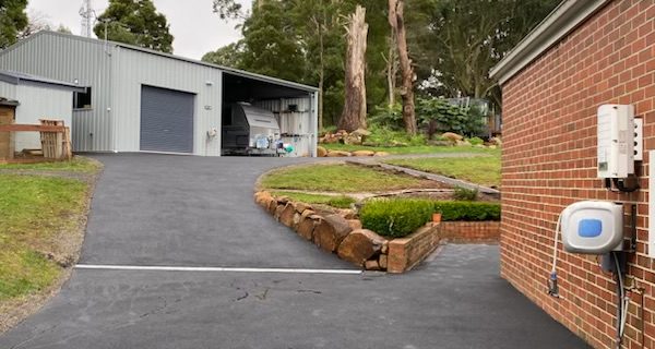 Asphalt driveway with stormwater cutoff in Ferny Creek.